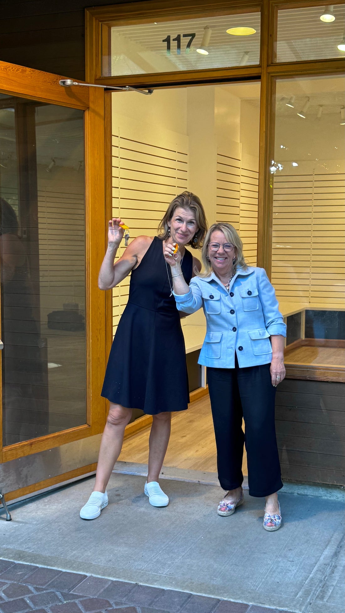 Owners Jayne and Christina with the keys to Waterlily Shoes new location at Matticks Farm