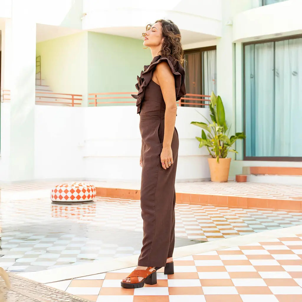 Woman in a brown pantsuiit wearing a pair of platform sandals by ART.