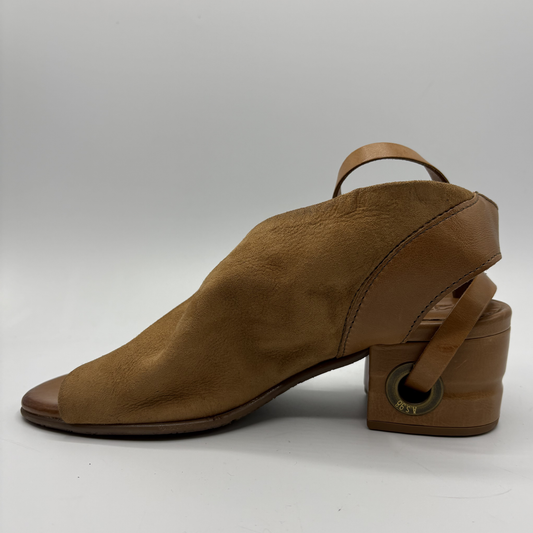 Brown suede shoe with a block heel on a white background