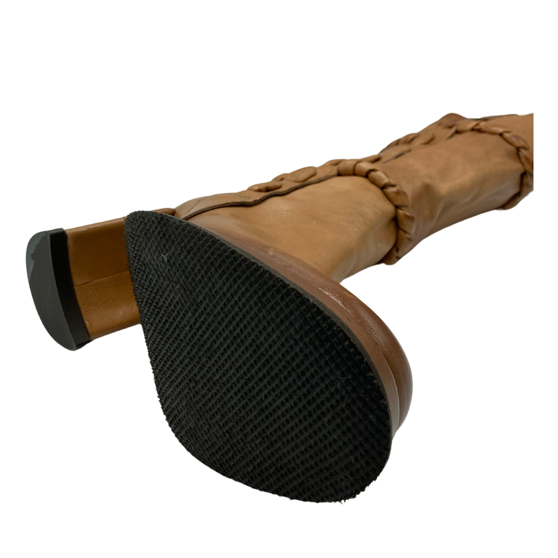 Bottom view of brown leather boot with black rubber outsole