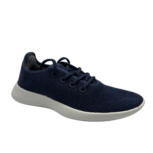 45 degree angled view of eucalyptus fiber running sneaker in a hazy indigo colour and white outsole.