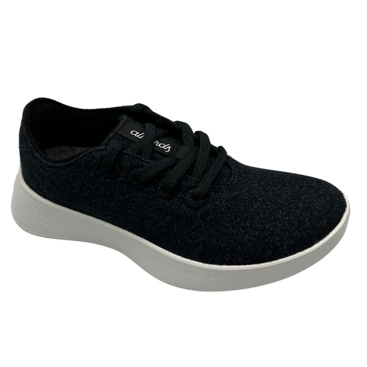 45 degree angled view of natural black merino wool sneaker with matching laces and white outsole