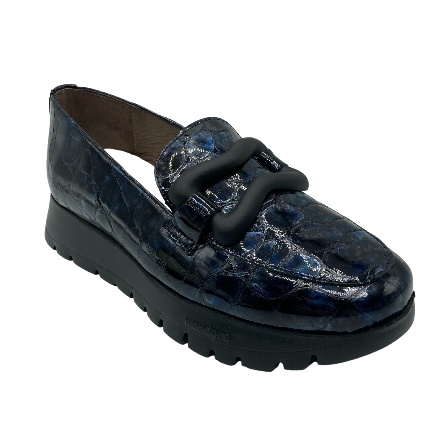 Angled side view of black/blue platform loafer with black sole.