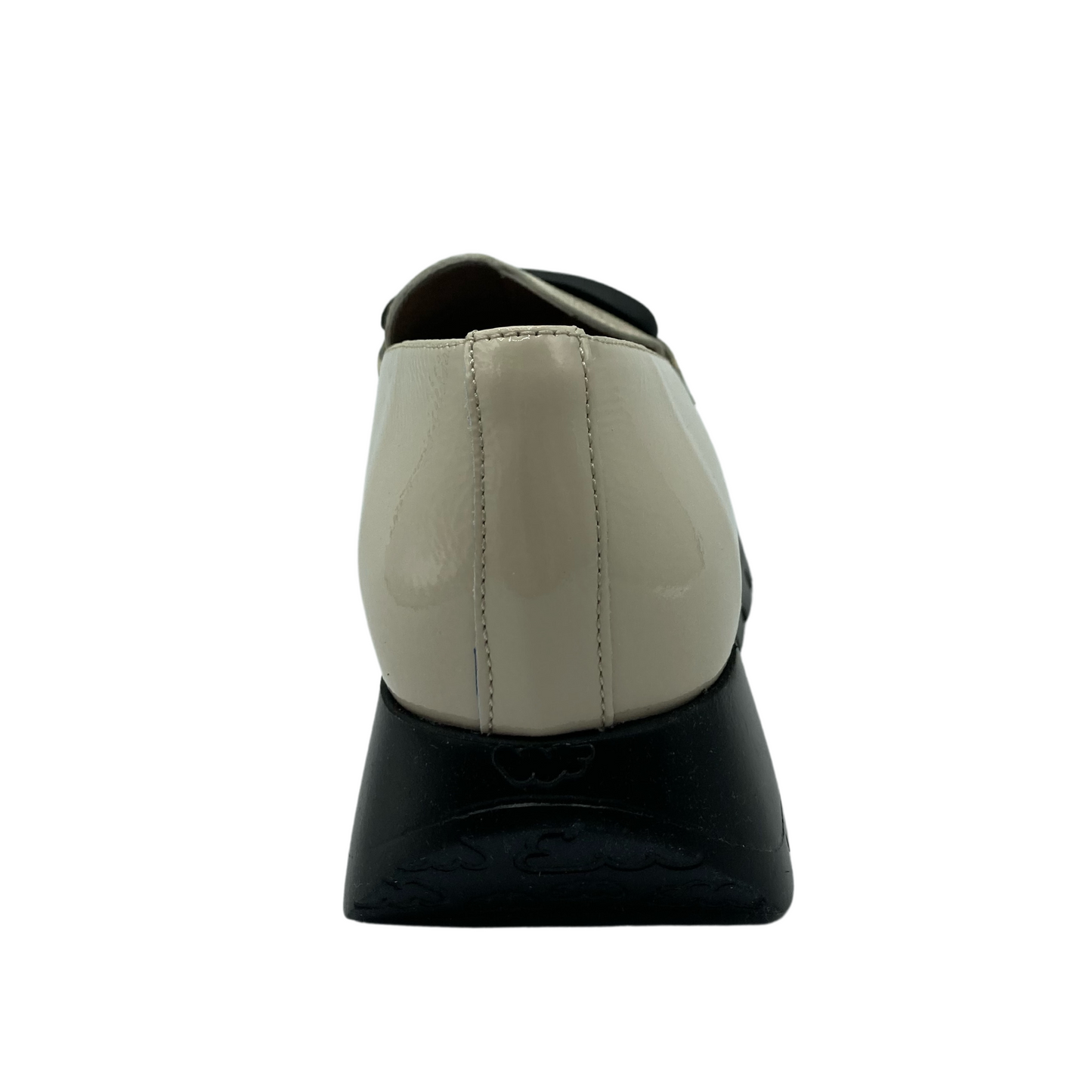 Heel view of the platform, cream coloured, leather loafer
