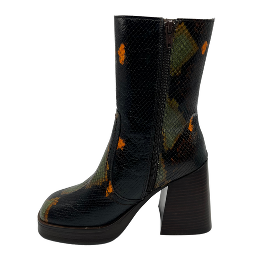 Left facing view of leather, snake print short boot. Chunky block heel, slightly squared toe and platform sole