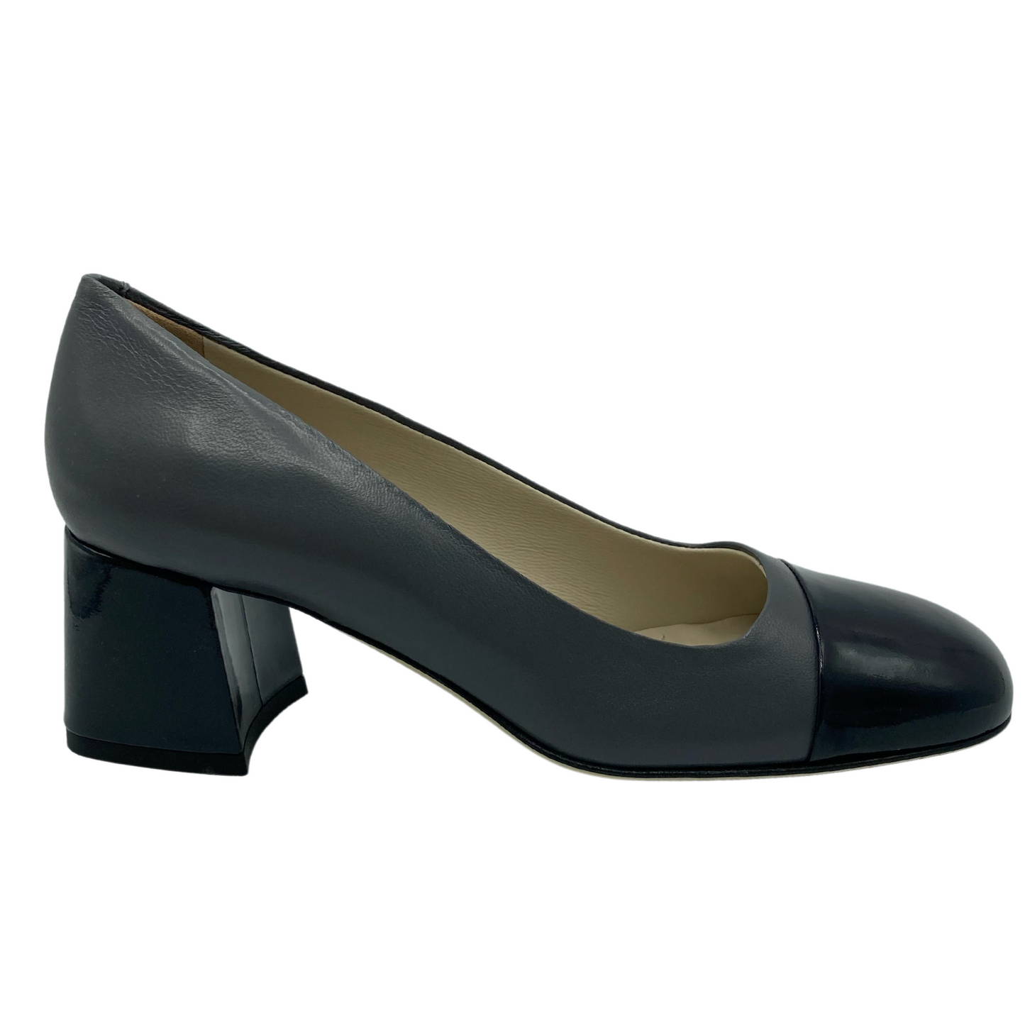 Right facing view of grey leather pump with navy toe cap and block heel