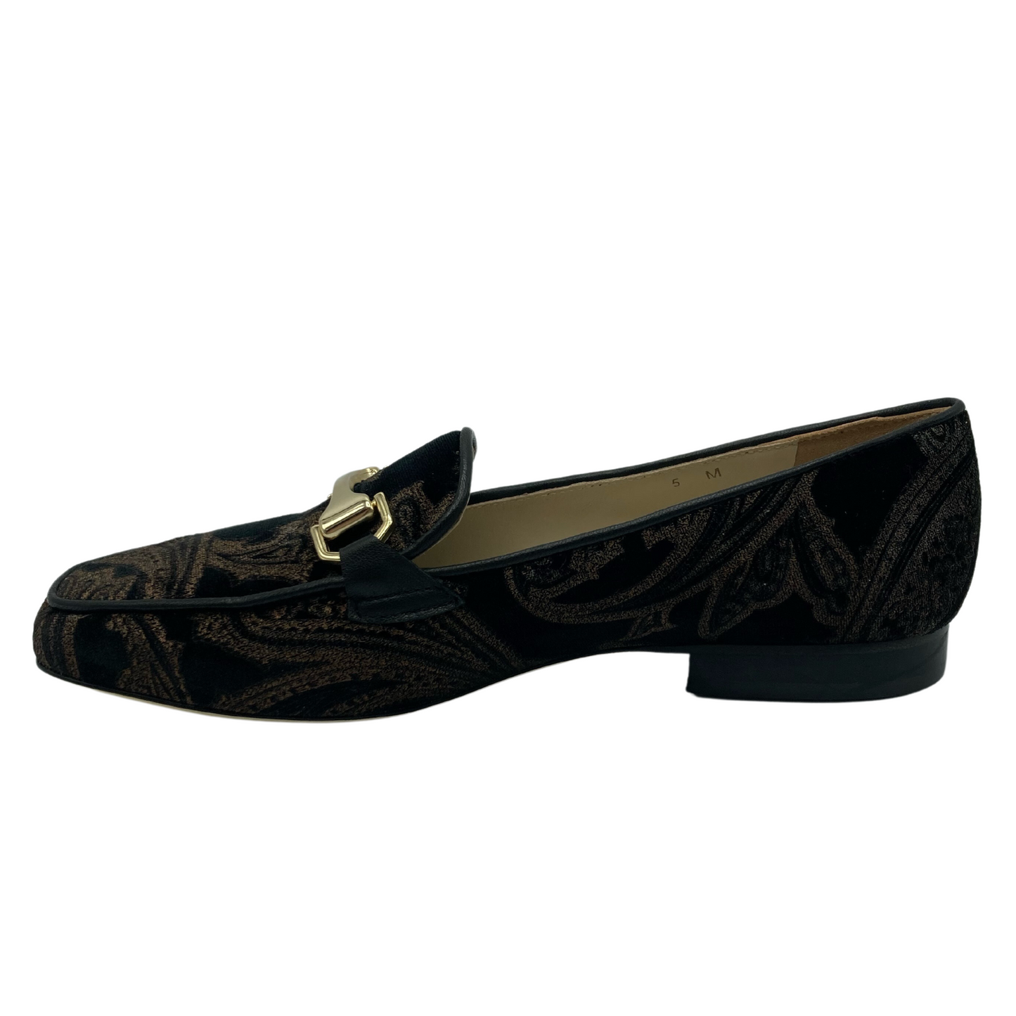 Left facing view of brown and gold loafer with gold bit detail on upper and leather lining