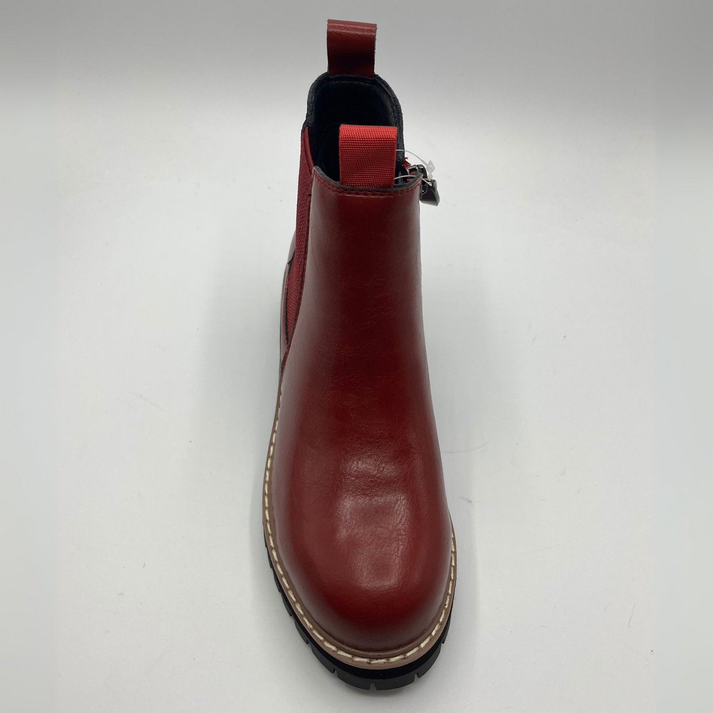Red leather boot on a white background