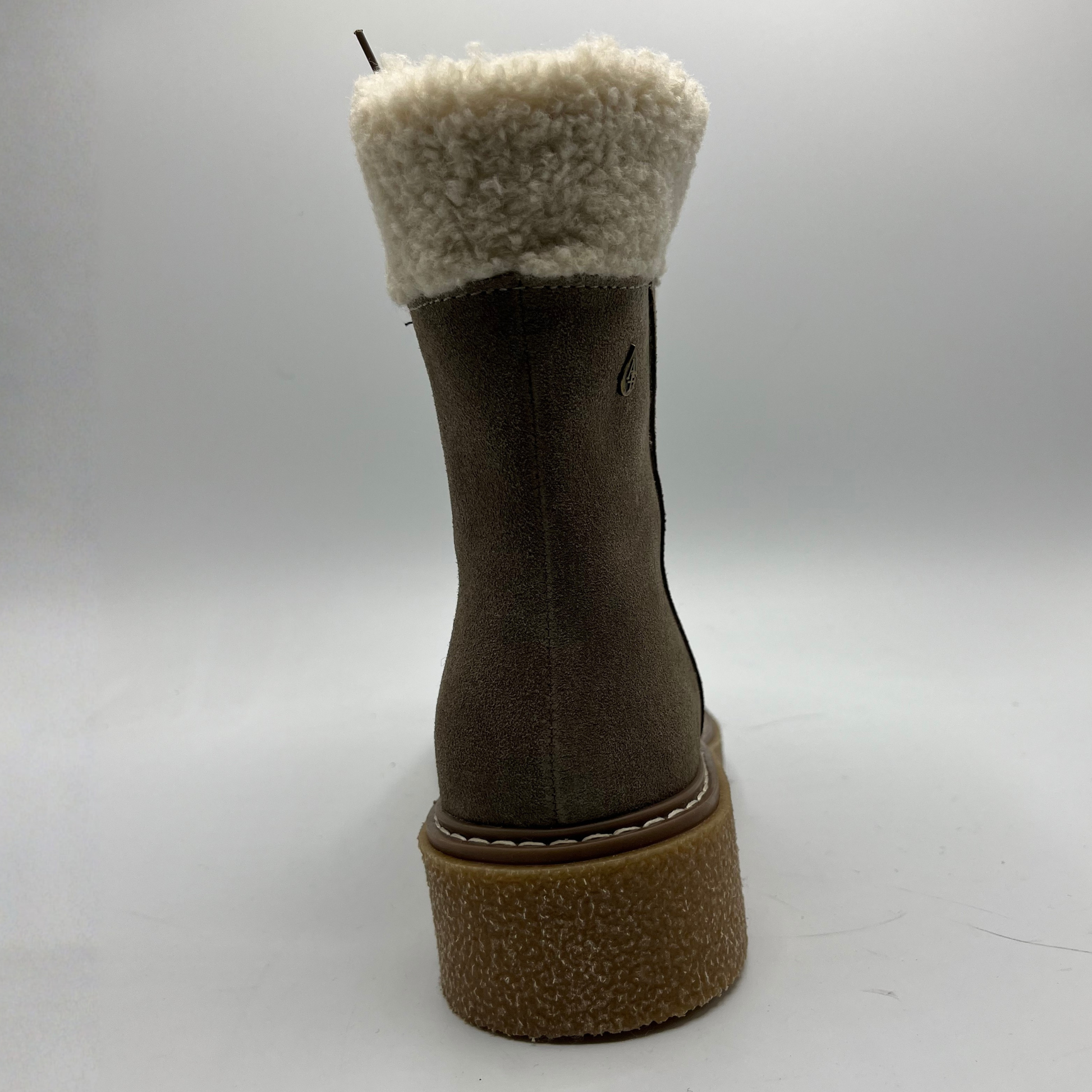 Brown boot with beige fur lining on a white background
