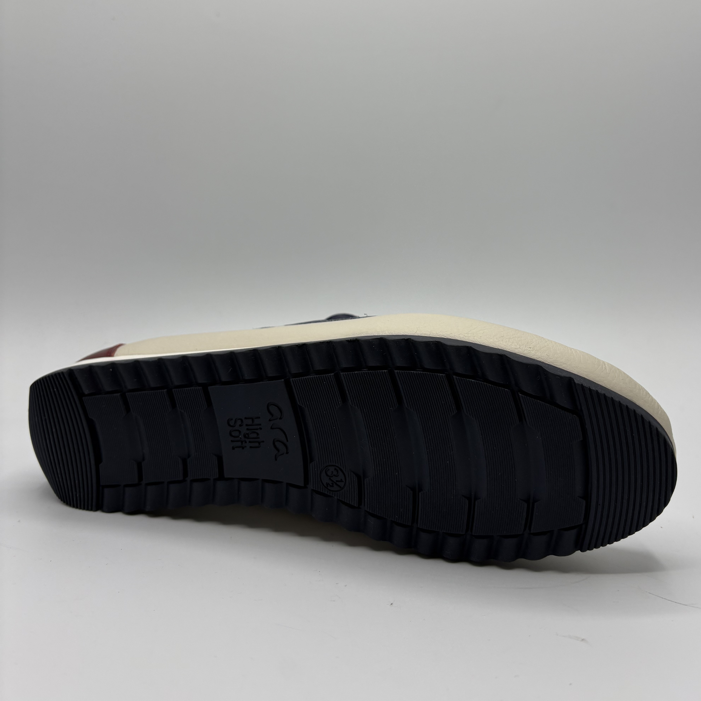 Black sole of a shoe on a light gray background
