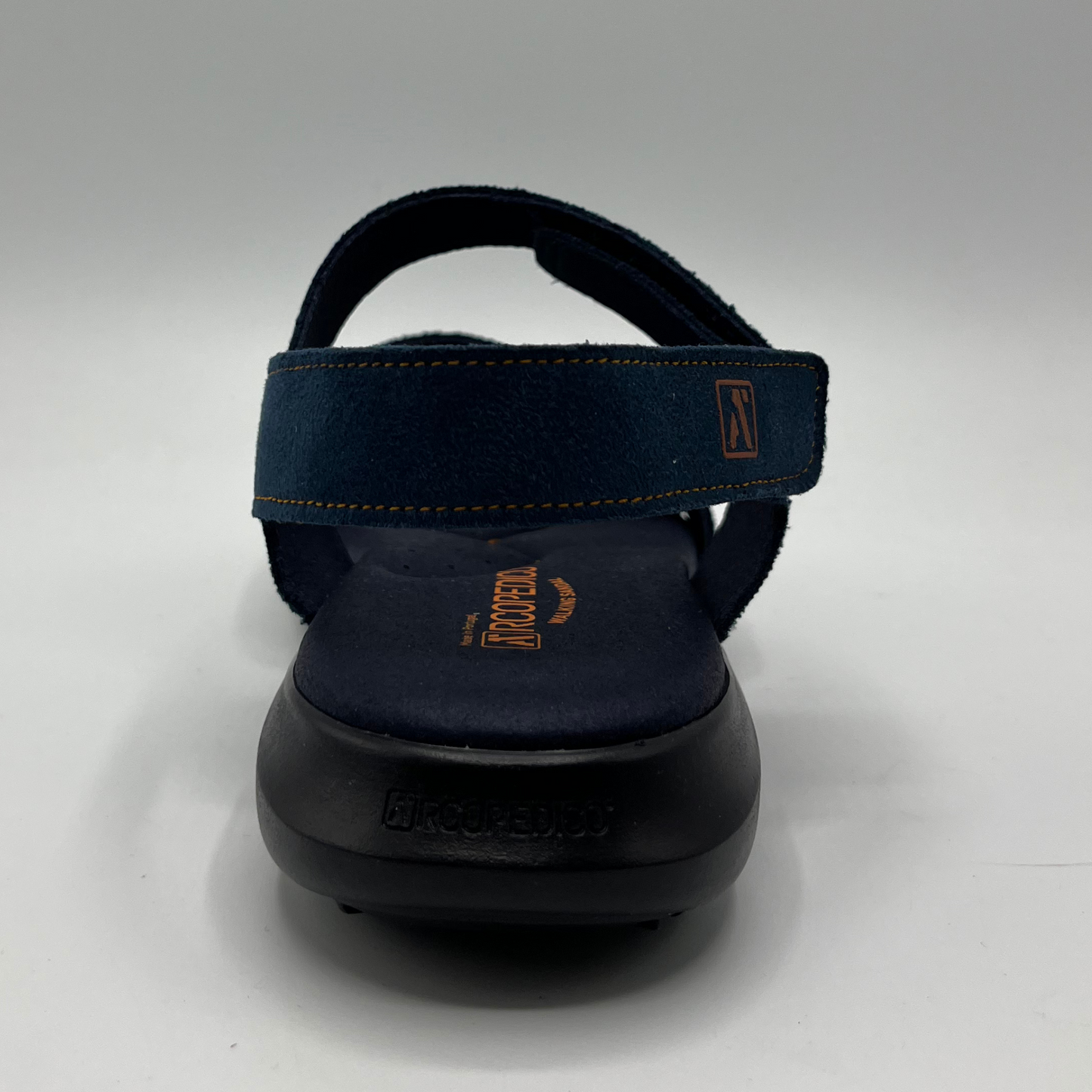 Back view of a blue multi-strap sandal with hook and loop closures and a black supportive outsole.