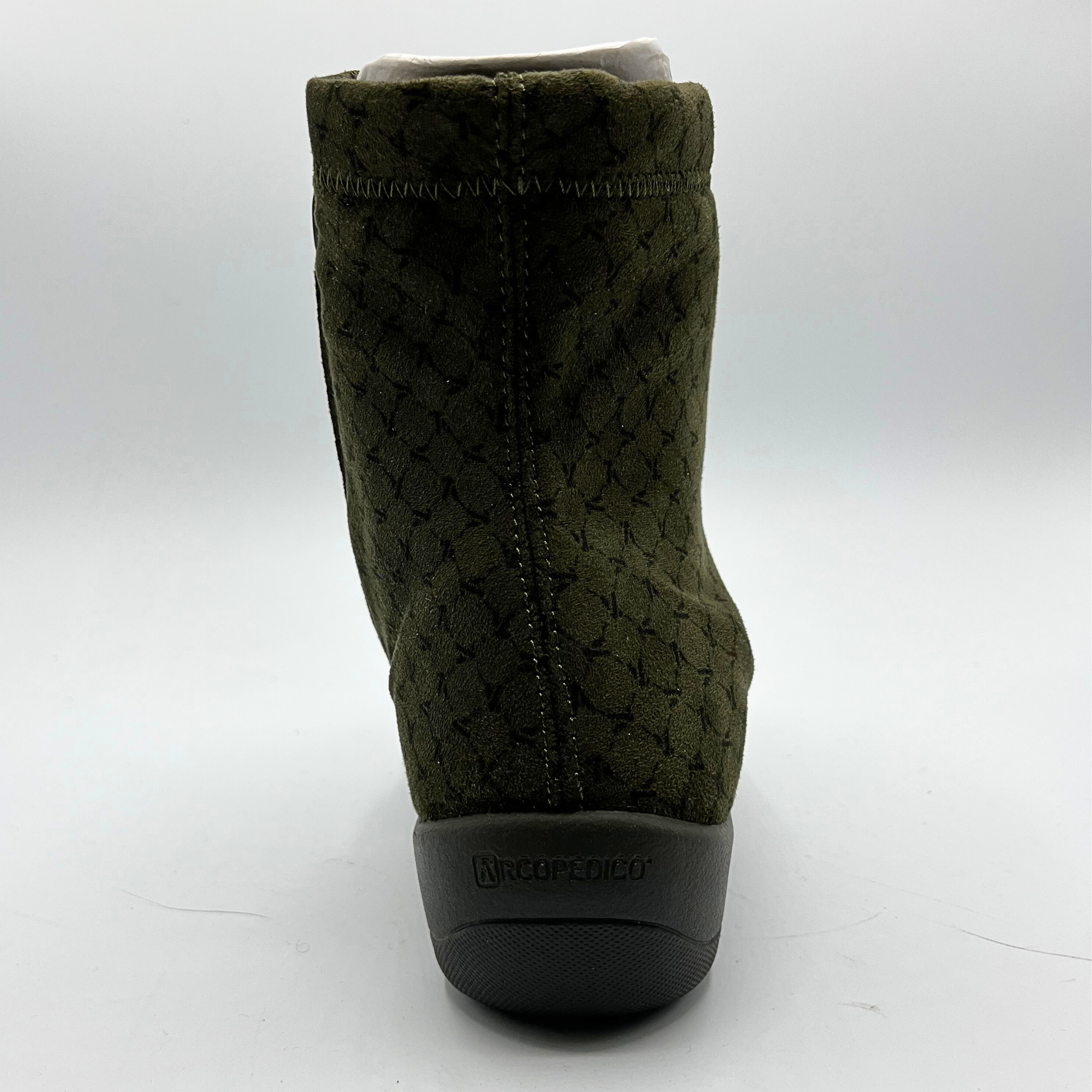 Green quilted boot with a black sole on a white background