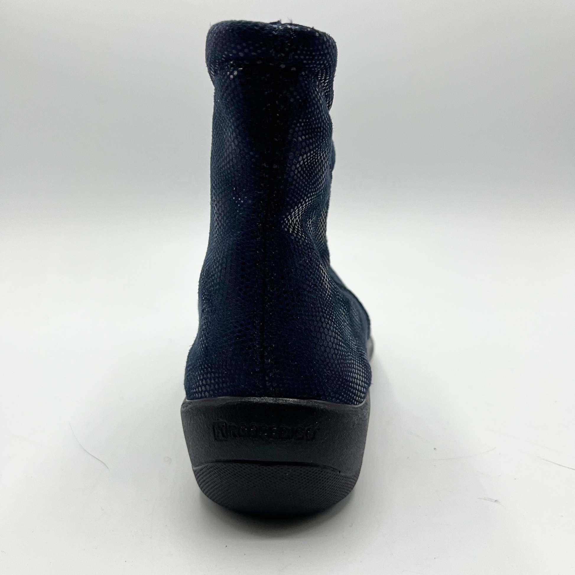 Navy short boot with a black outsole on a white background