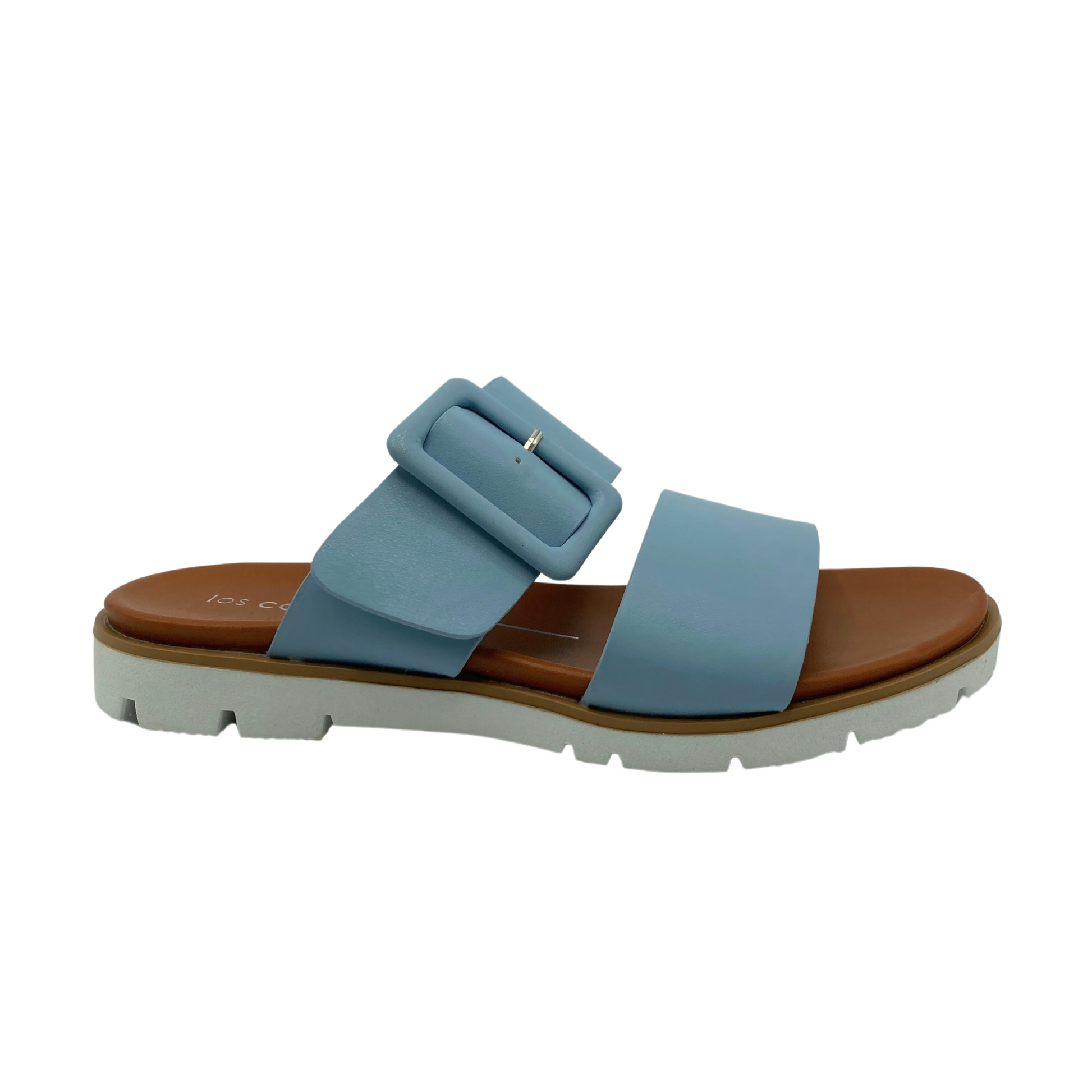Outside view of a sandal in a baby blue tone upper.  Sole is brown and outsole is white.  Two wide straps across foot