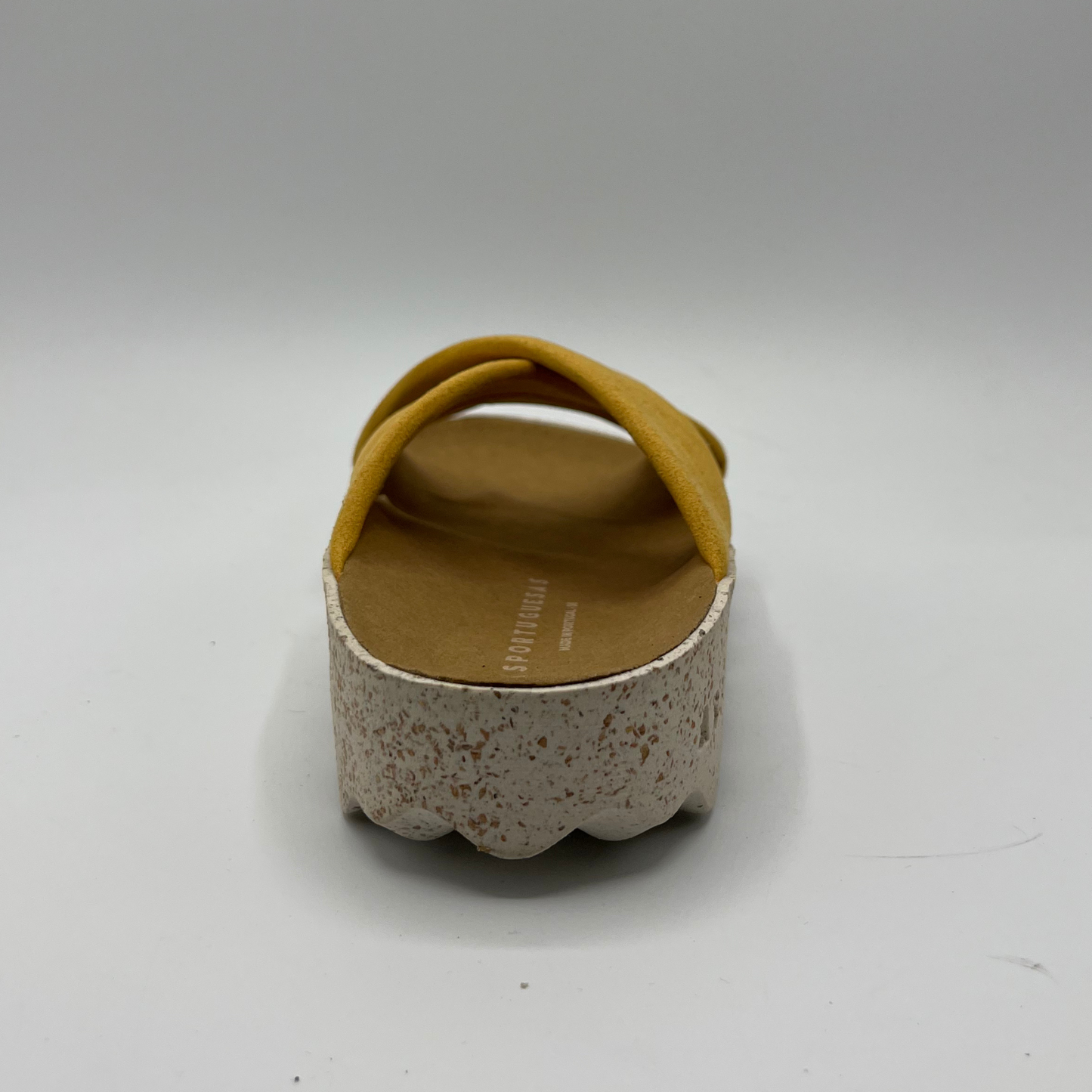 Back view of cushioned, cross strap sandal with a contoured footbed and white speckled outsole.