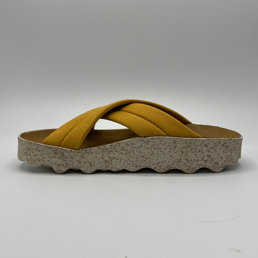 Left facing view of cushioned, cross strap sandal with a contoured footbed and white speckled outsole.