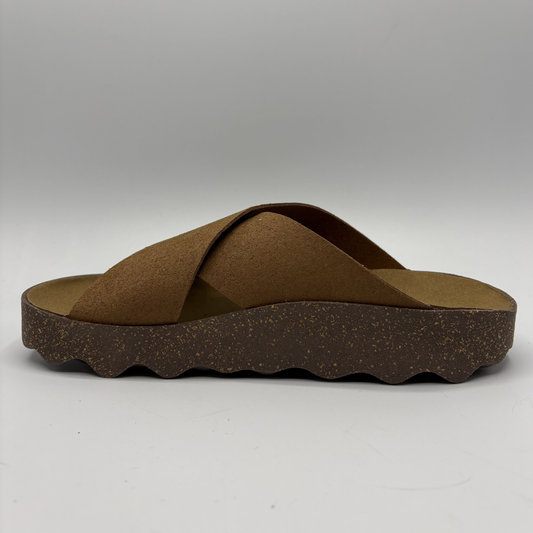 Brown sandal with criss-cross straps on a white background