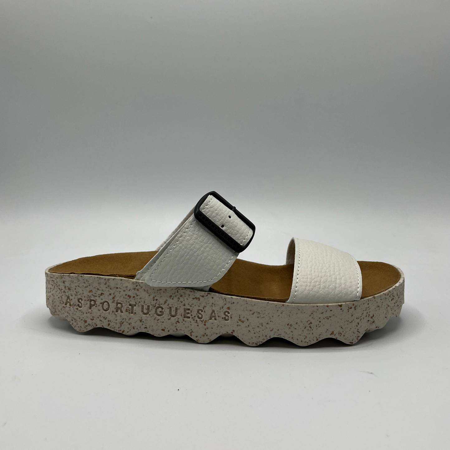 Right facing view of double strap white faux leather sandal with a contoured footbed and thick white and brown speckled outsole.