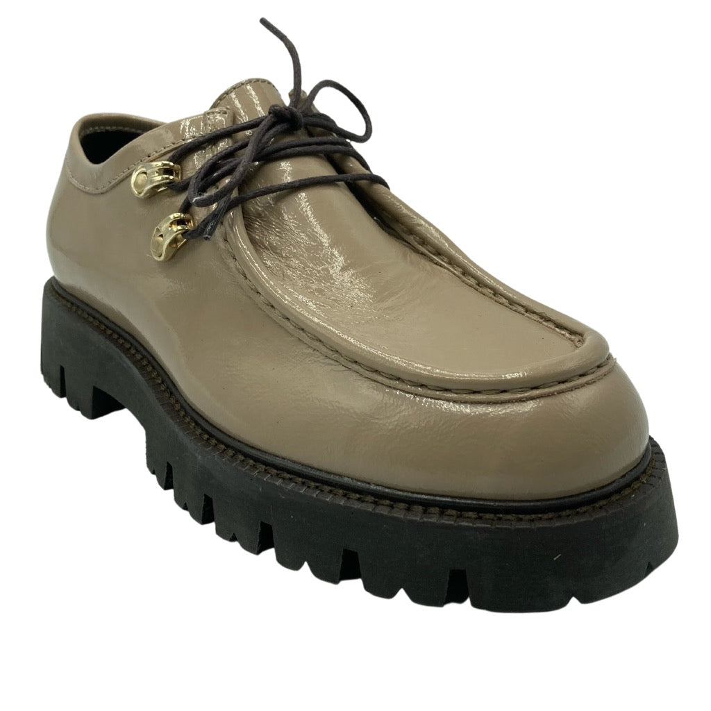 45 degree angled view of taupe leather loafer with gold laces hardware and thick brown lug sole