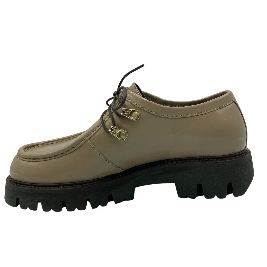 Left facing view of taupe leather shoe with brown rubber lug sole