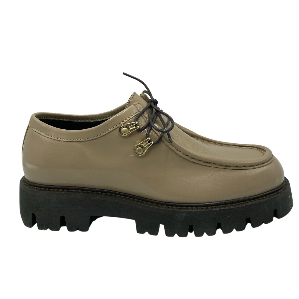 Right facing view of taupe leather loafer with brown rubber lug sole