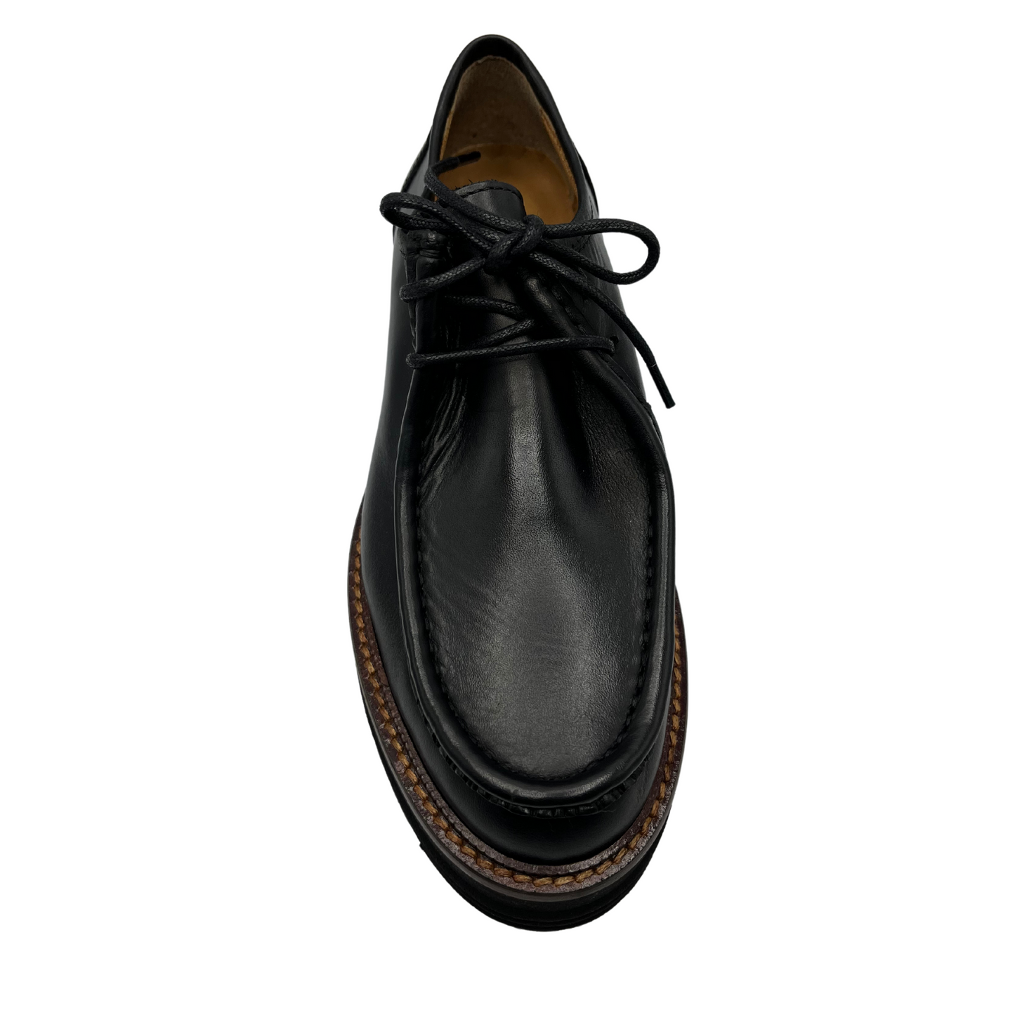 Top view of black leather loafer with thick black outsole and leather lining