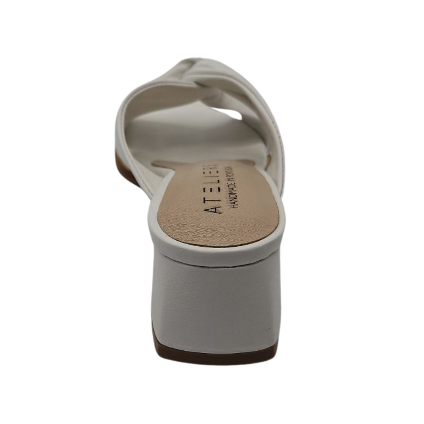 Back view of white leather sandals with a soft square toe. These heels have a leather lining and leather wrapped block heel. Knotted straps on upper