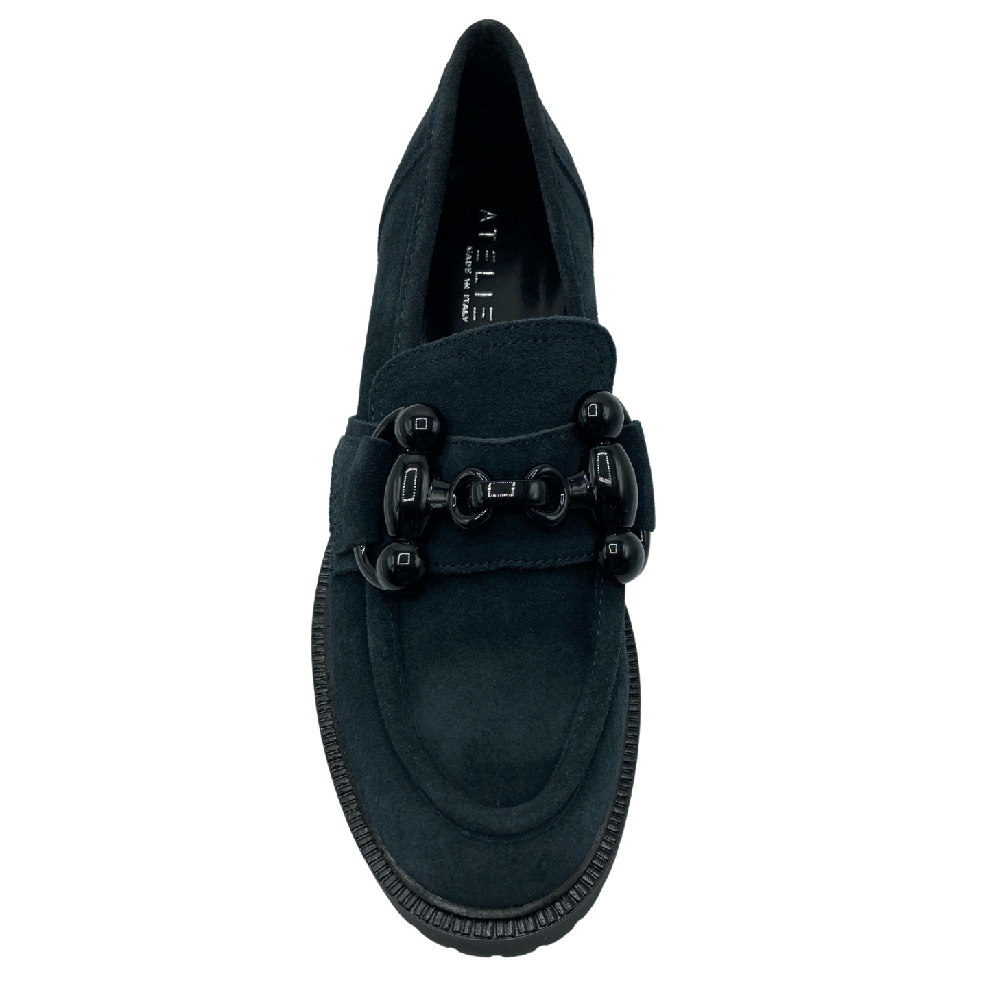 Top view of navy suede loafer with black buckle detail on upper and almond toe