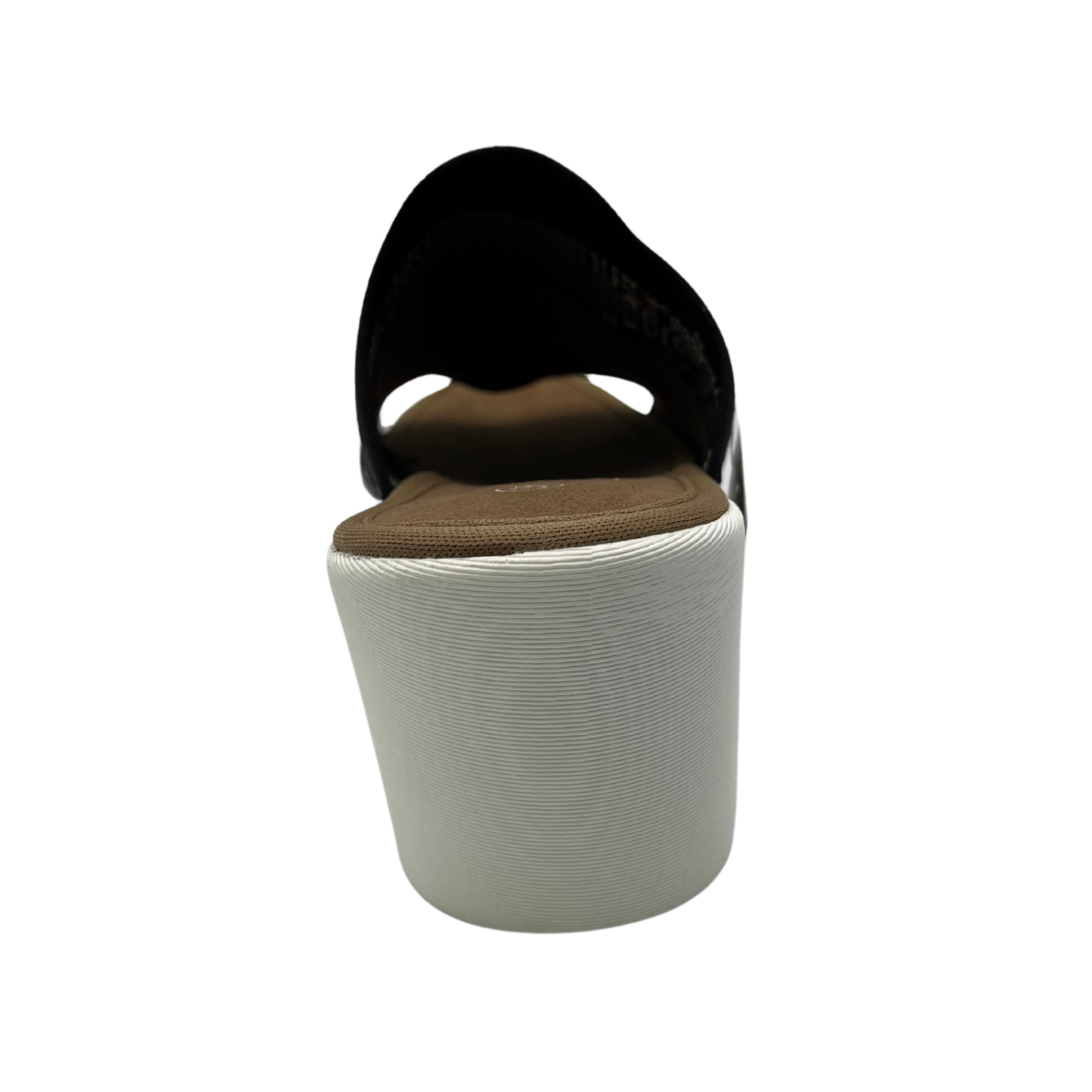 Back facing view of a slip on wedge heel. White rubber outsole and stretchy knit upper.