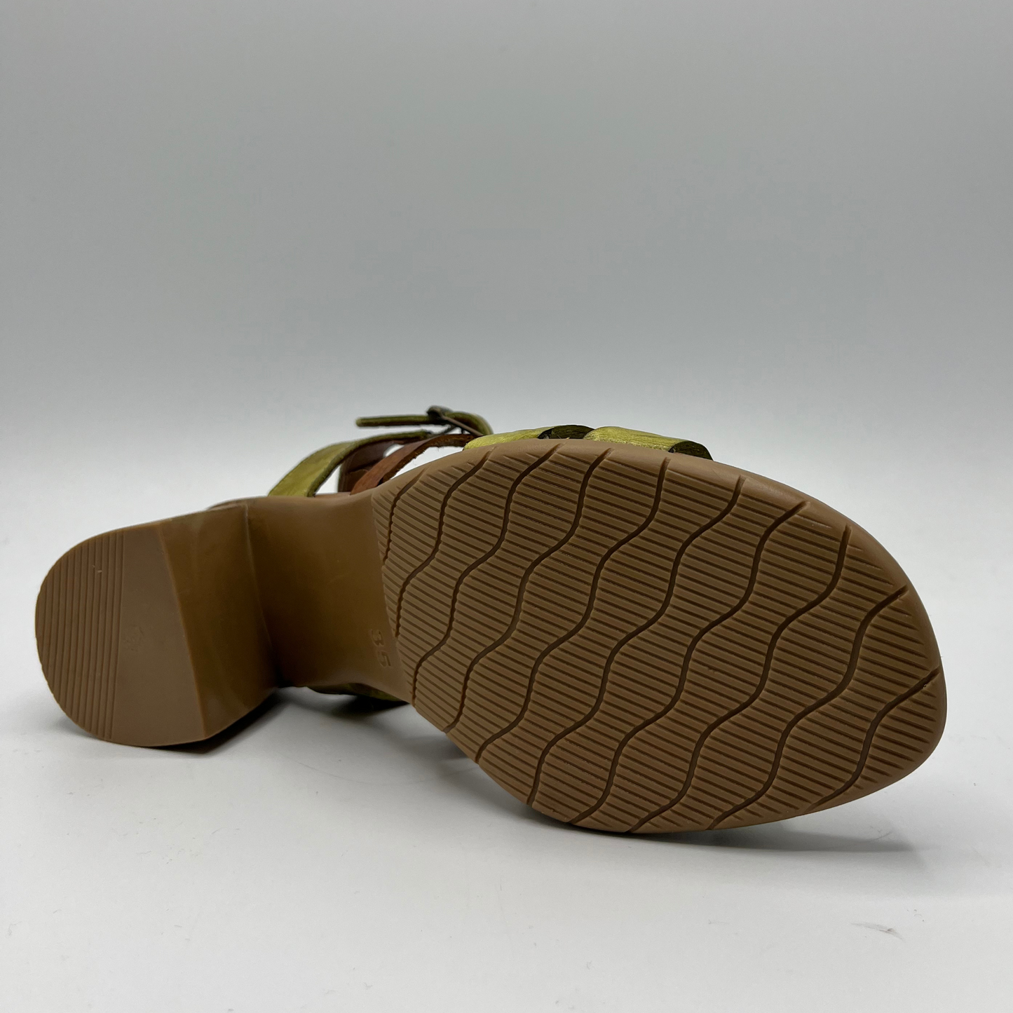 Bottom view of a multi strapped leather sandal with cushioned insole and a wood looking wrapped block heel.