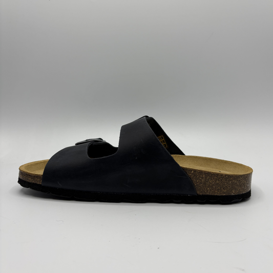 Black sandal with cork sole on a gray background