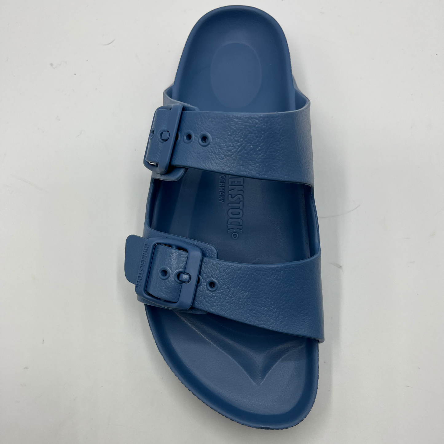 Top view of a lightweight EVA sandal in a blue colour with two adjustable straps.
