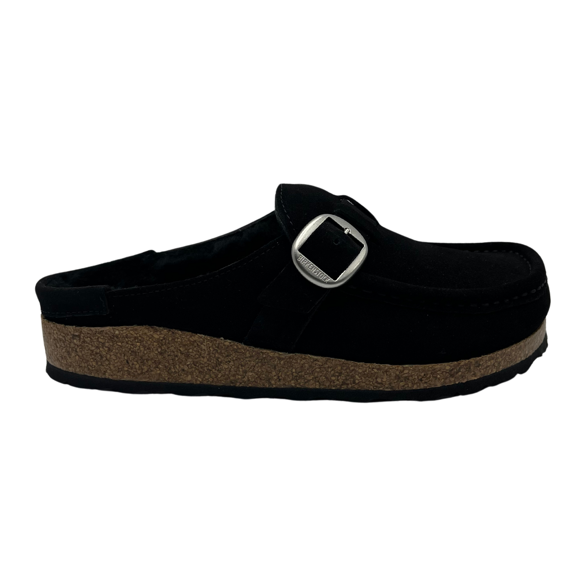 Right facing view of black, shearling lined clog with a silver buckled and anatomically correct footbed