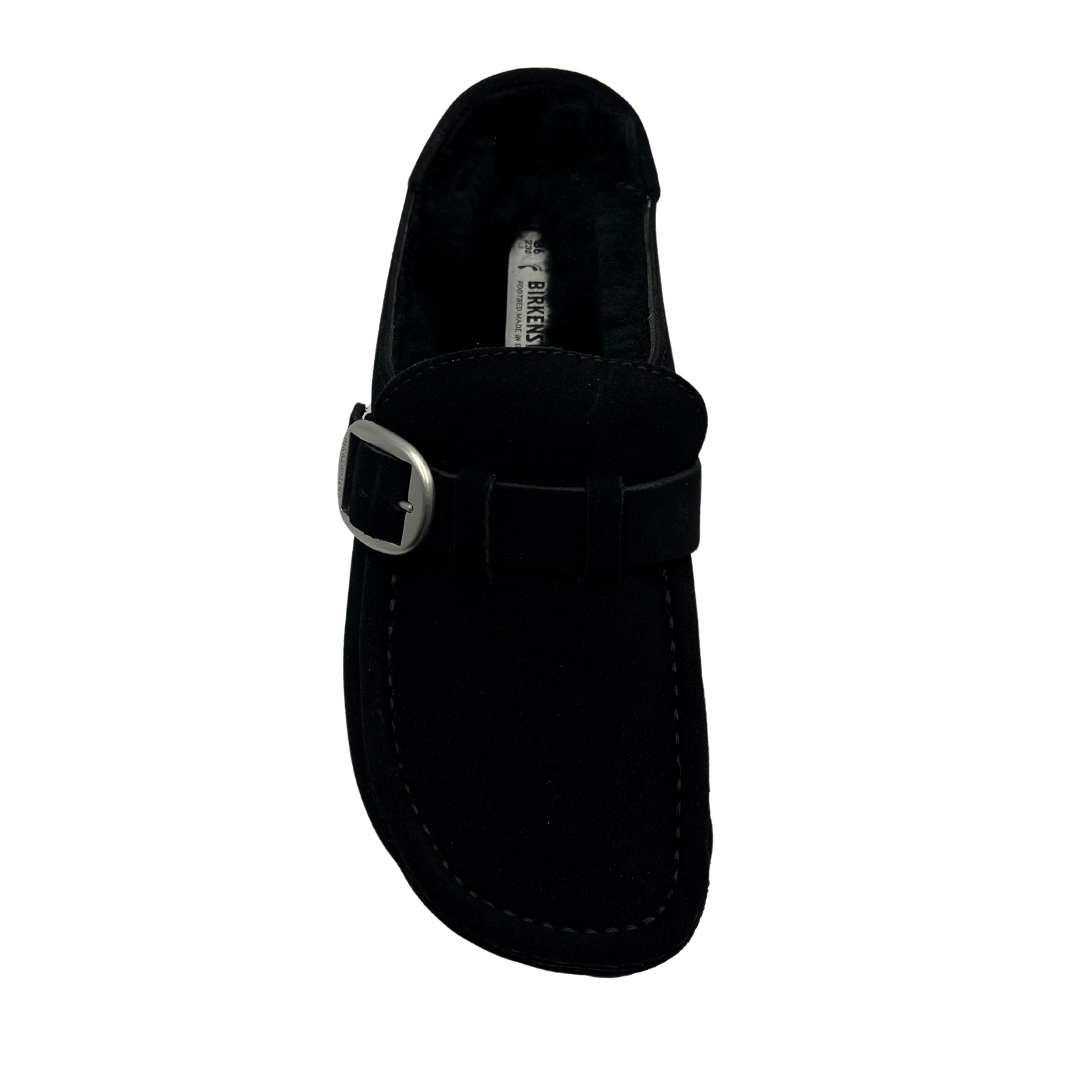 Top view of black, shearling lined clog with a silver buckled and anatomically correct footbed