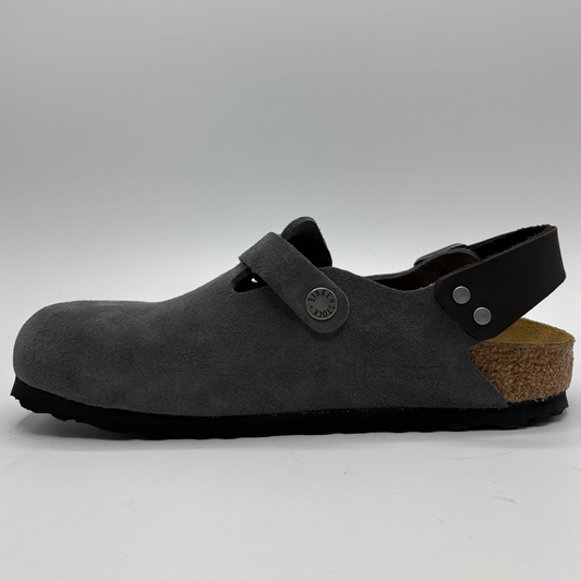 Left facing view of a charcoal slip on shoe with two adjustable buckle straps on a white background