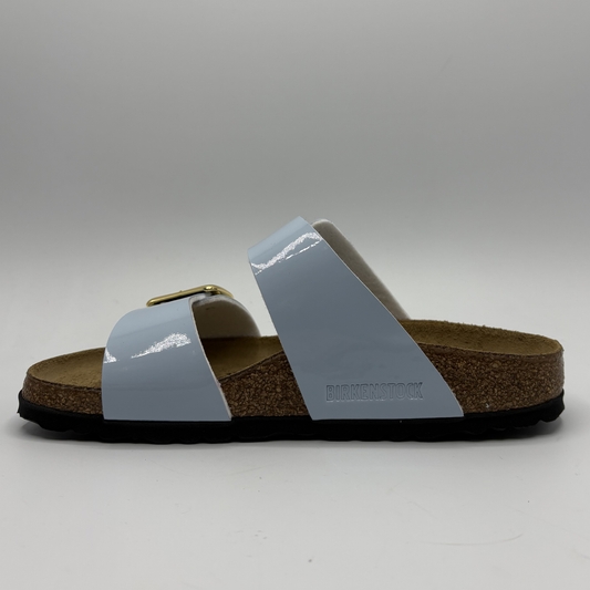 Single sandal with a blue strap on a gray background
