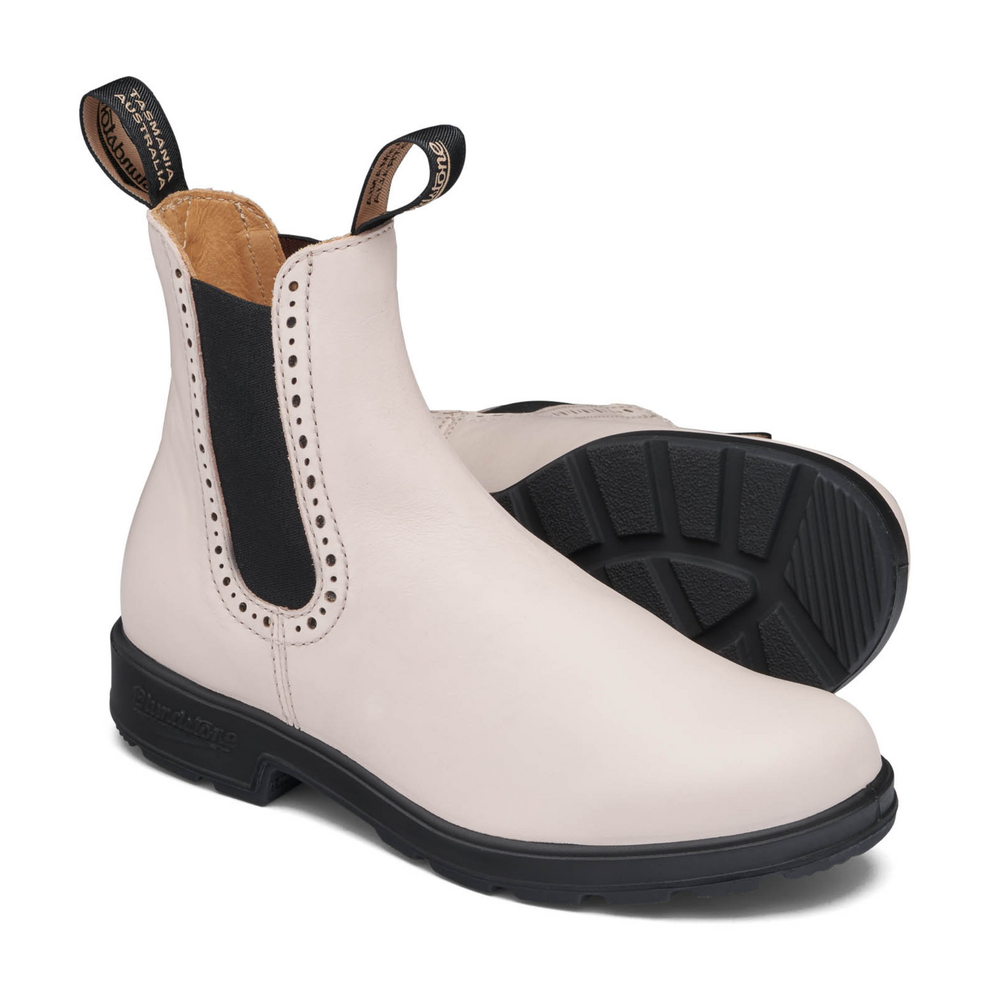 View of a pair of ankle boots, one standing up the other on it's side with the black rubber sole facing forward.