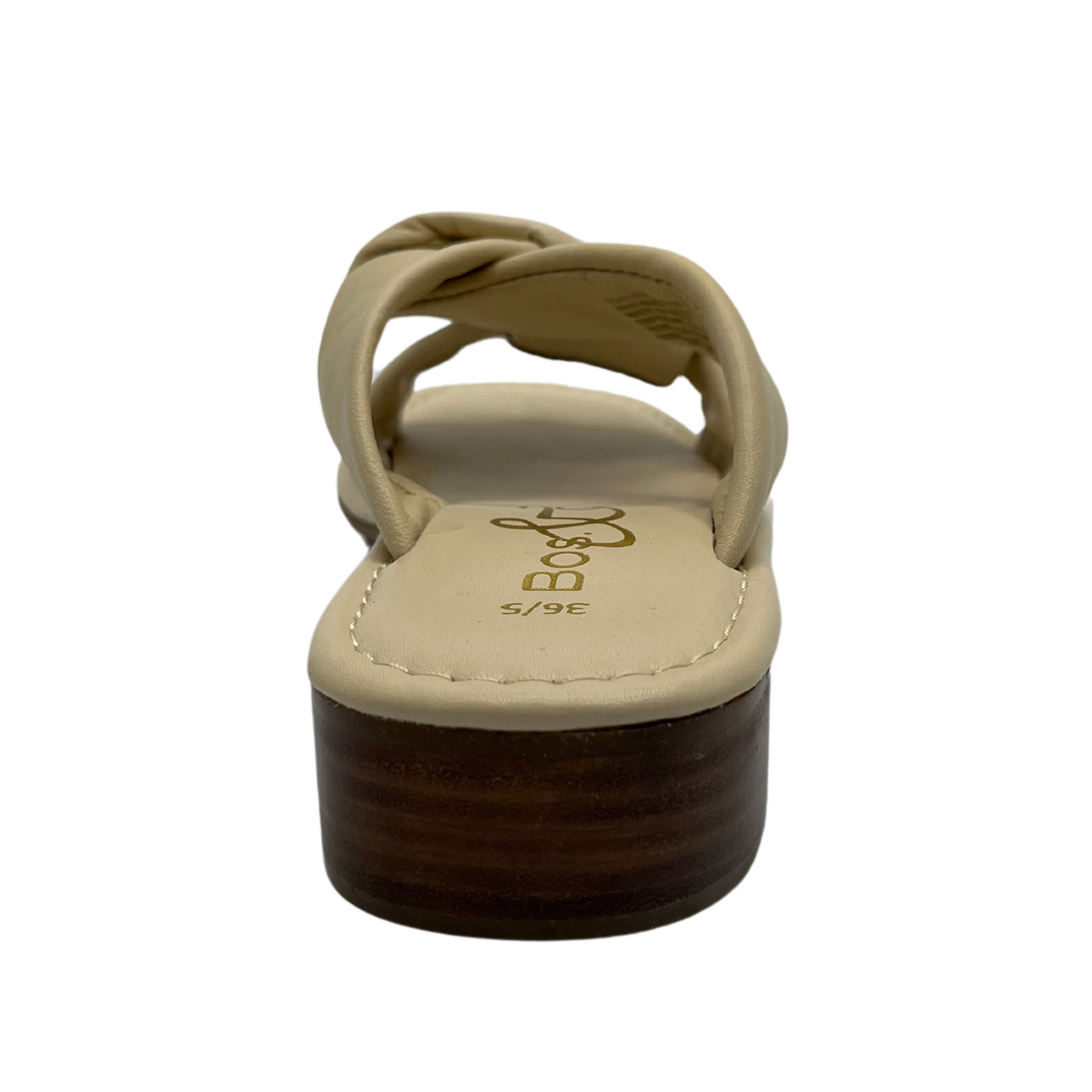 Back view of cream leather sandal with short block heel and large knot detail on straps.