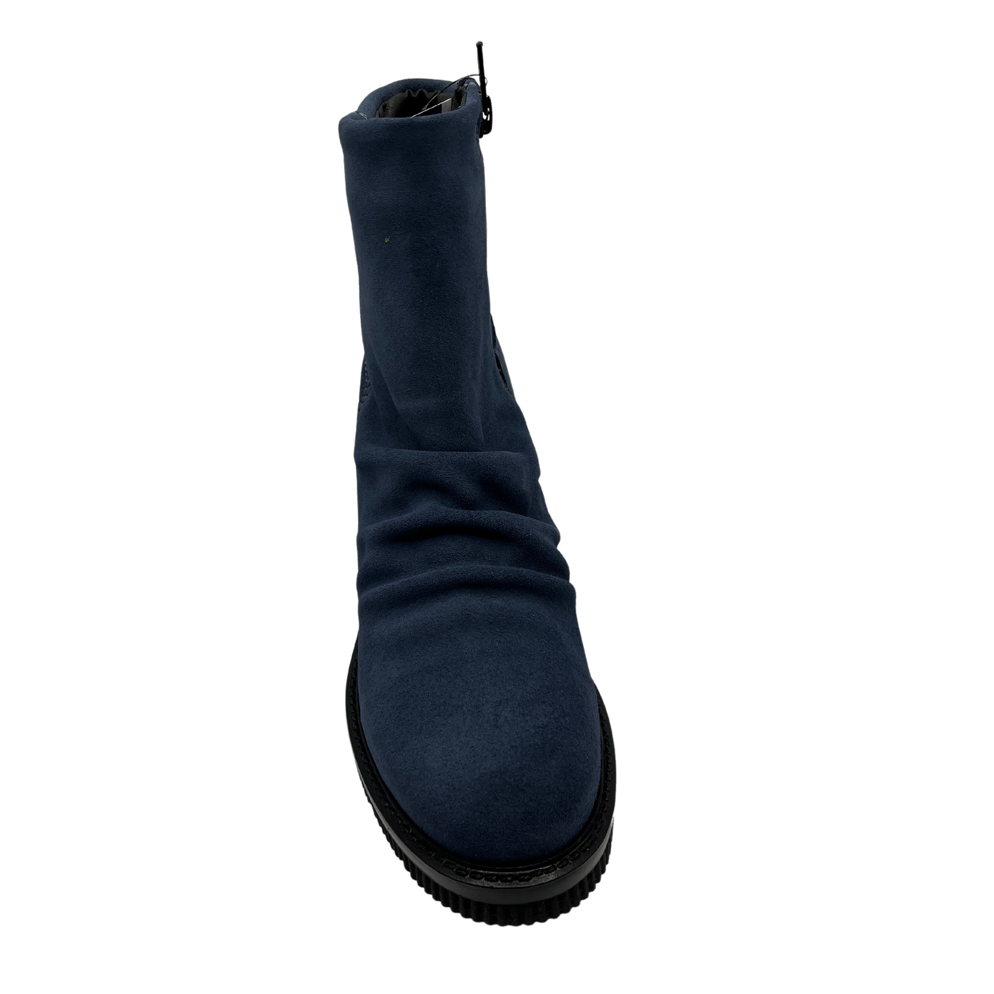 Front view of denim blue short bootie with slouched front, side zipper closure and black wedge heel.