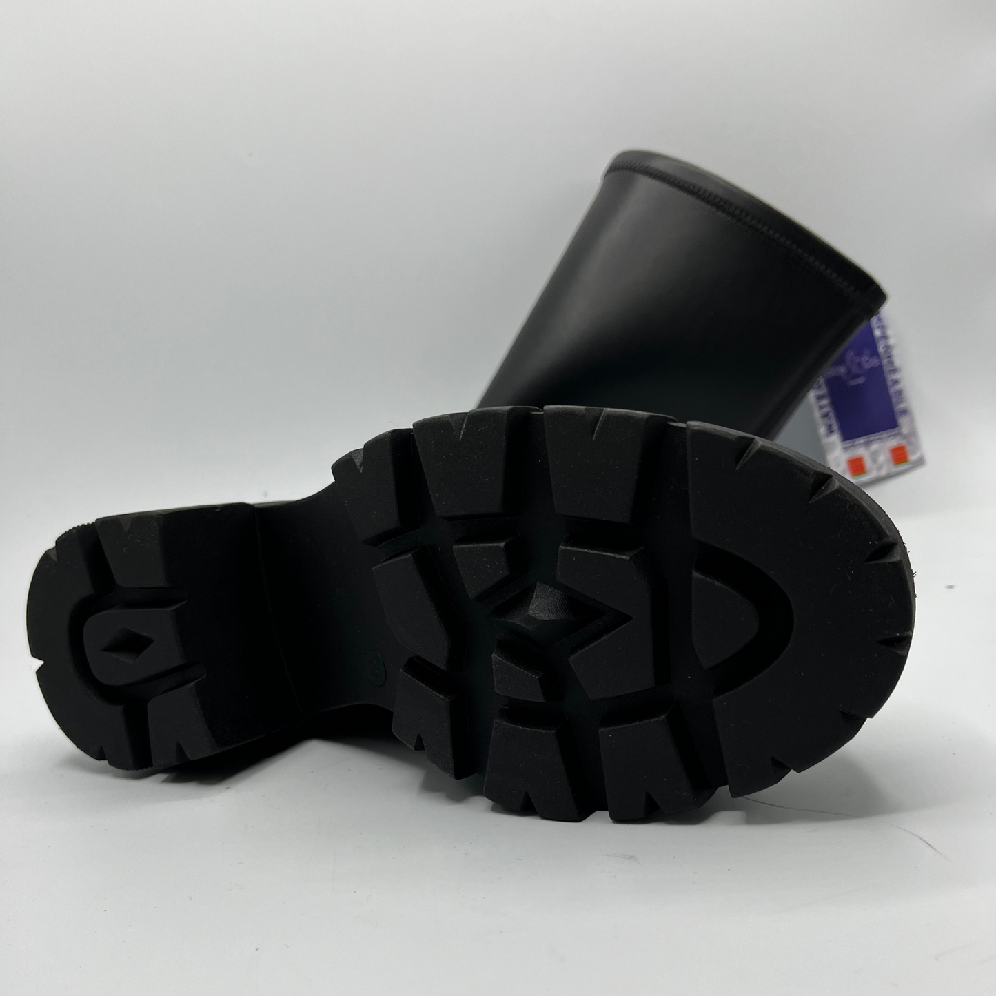 Black rubber boot sole on a white background