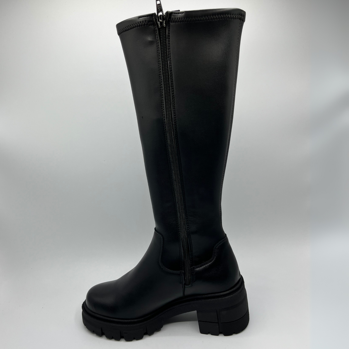 Black knee-high boot with a zipper on a white background