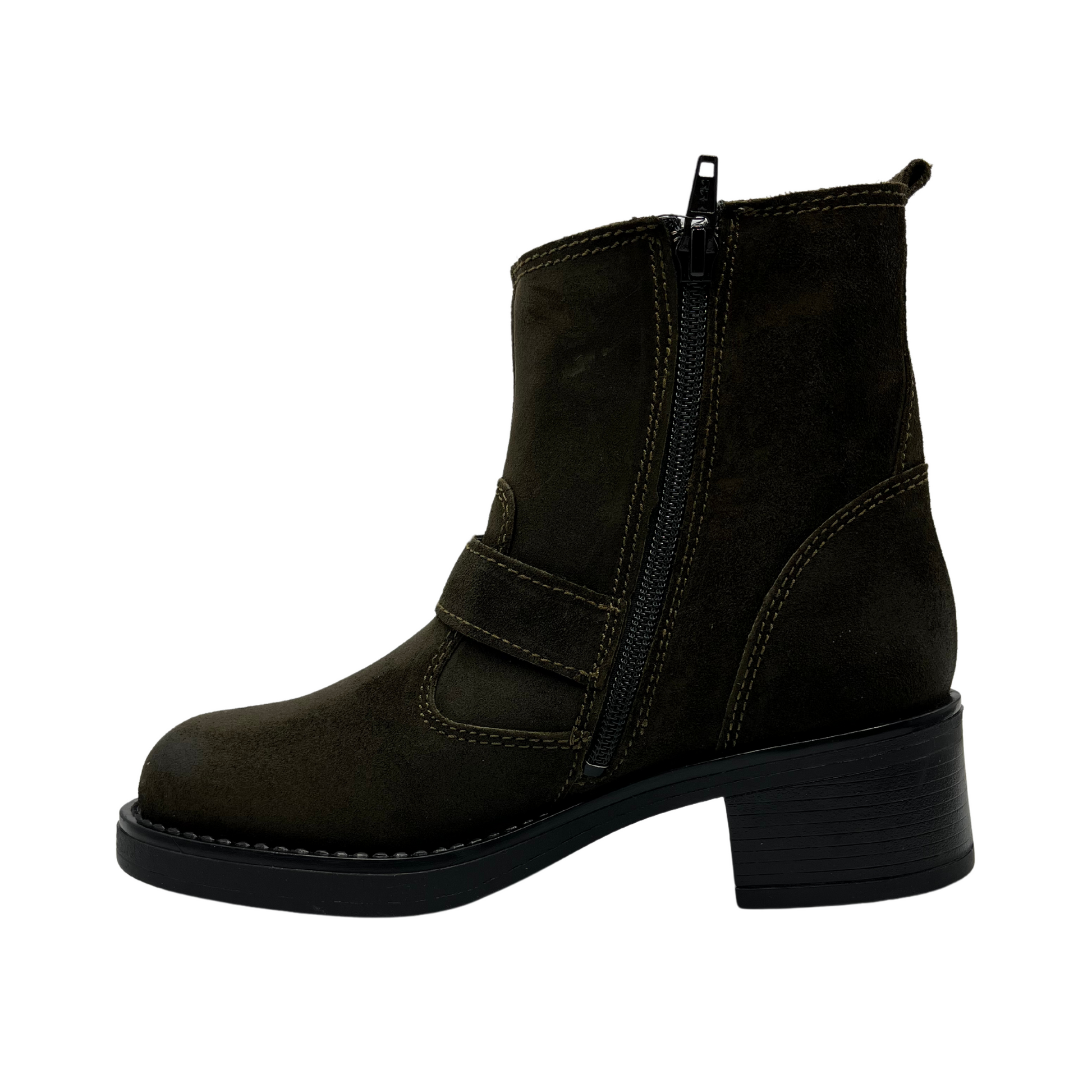 Left facing view of olive colored suede short boot with two straps with brass buckles, side zipper closure and block heel.