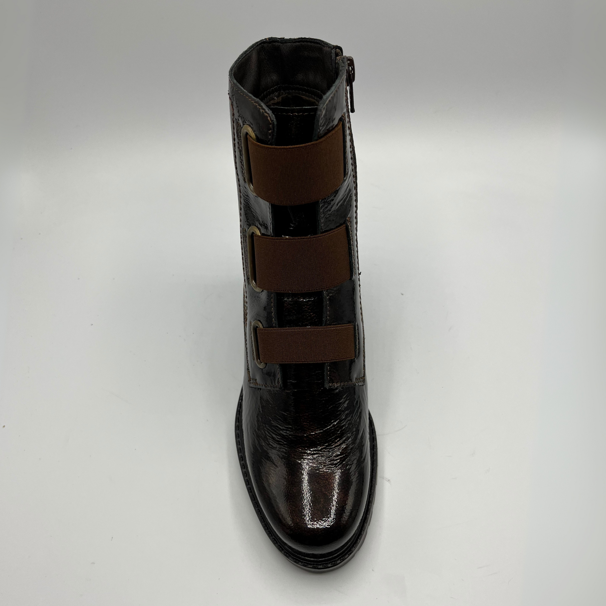 Chocolate  leather boot with brown accents on a white background