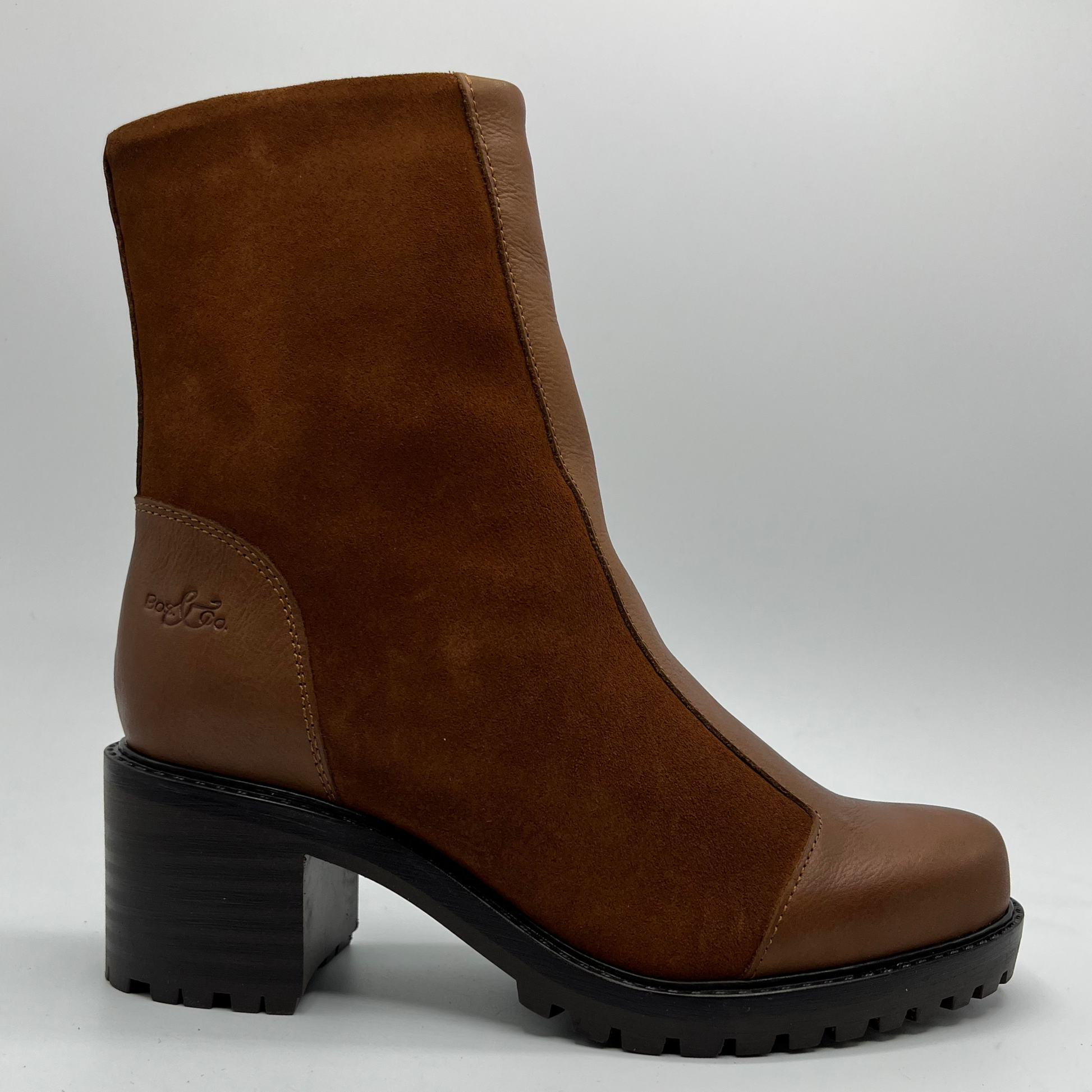 Red brown ankle boot with a block heel on a light gray background