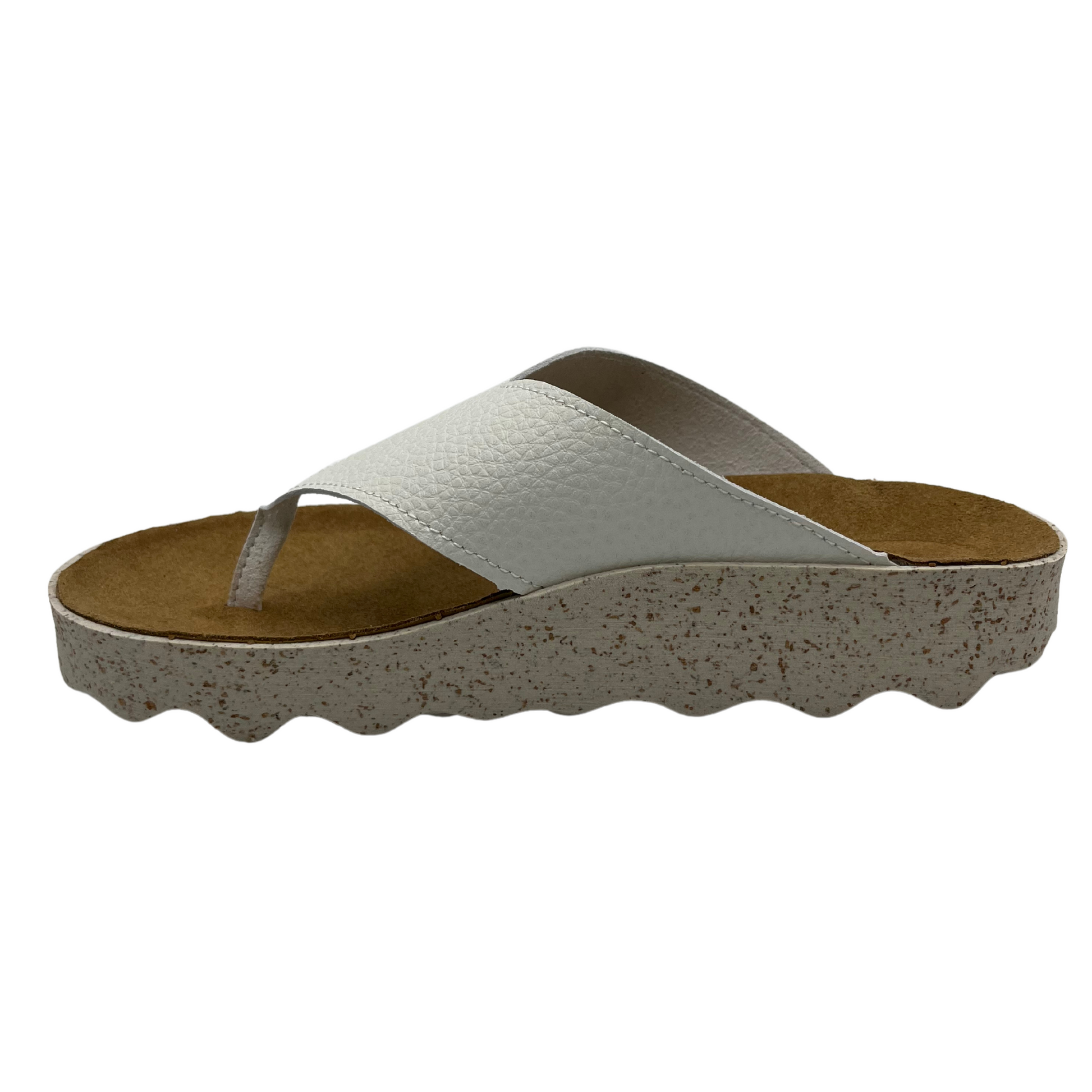 Left facing view of white strapped thong sandal with brown contoured footbed and white speckled outsole