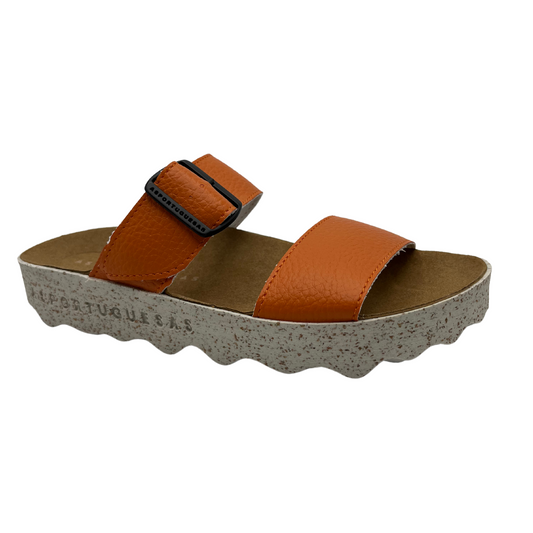 45 degree angled view of orange strapped sandal with contoured footbed and speckled white and brown outsole