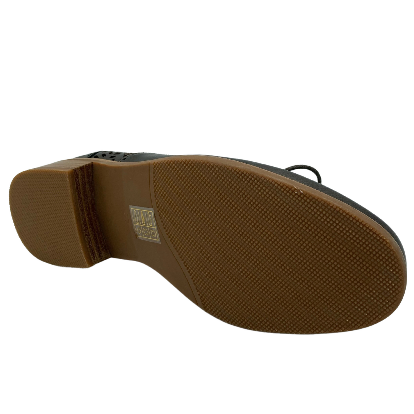 Bottom view of leather shoe with light brown sole and short heel