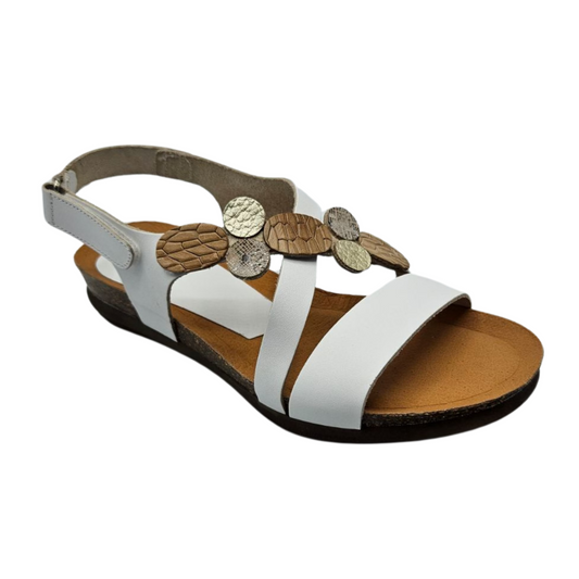45 degree angled view white leather sandal with mixed metallic accents on upper strap. It has a velcro ankle strap and rounded toe.