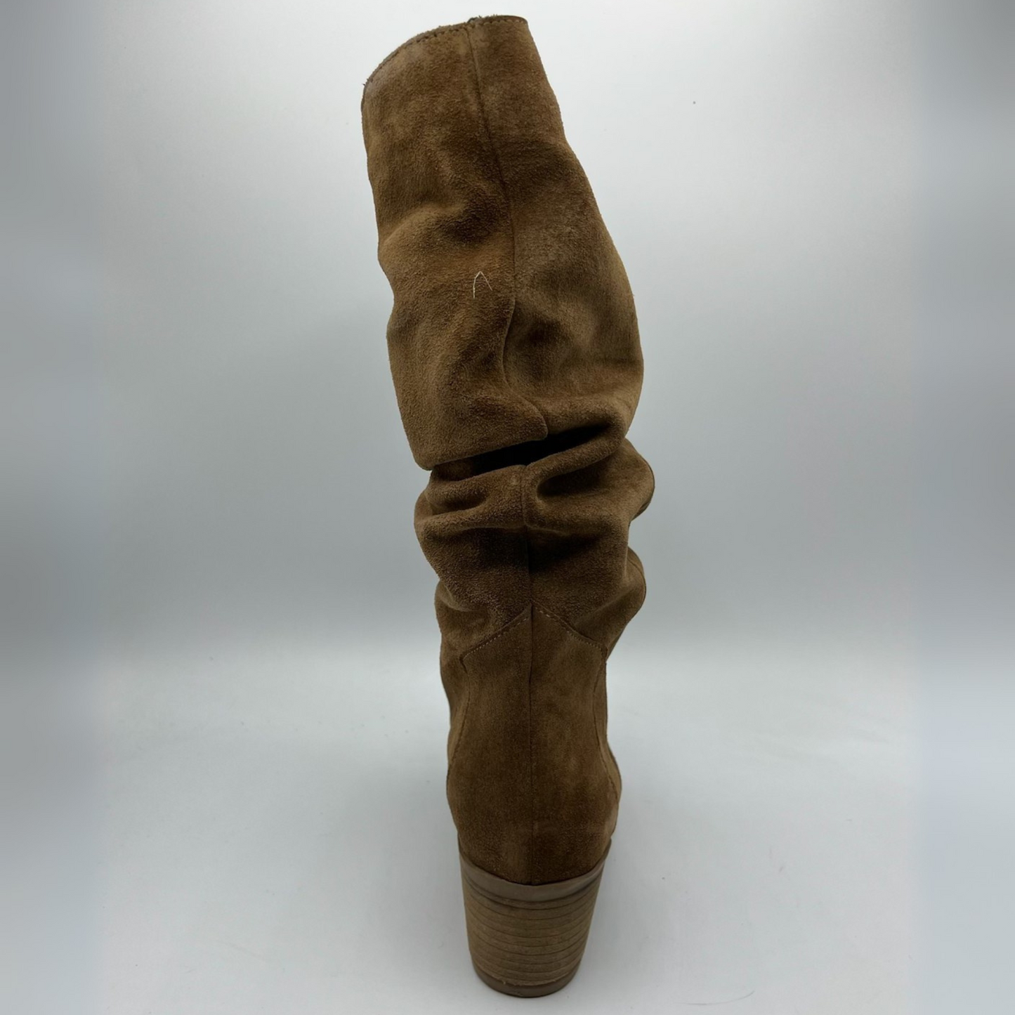 Brown suede boot on a white background