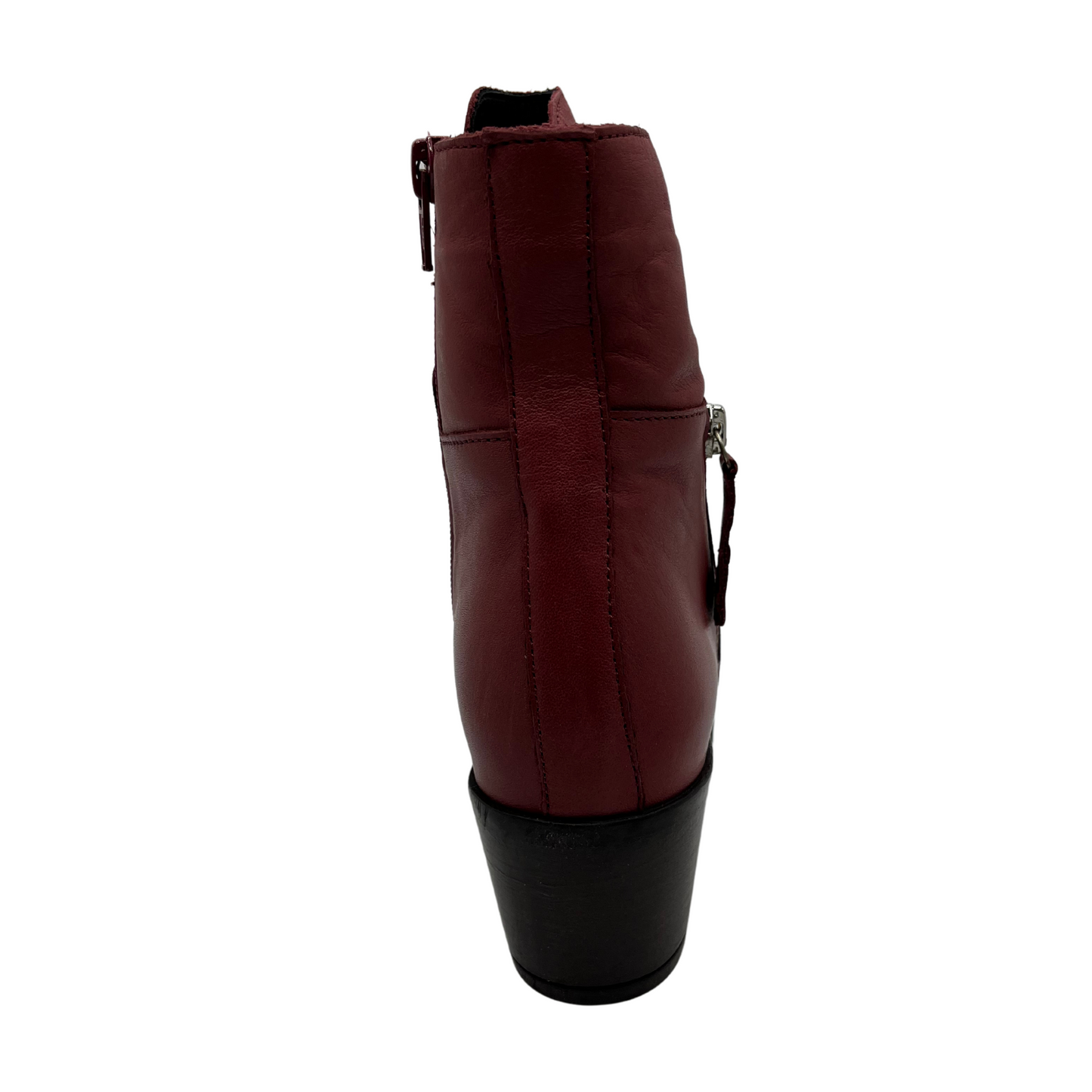 Back view of red leather short boot with a slouchy rouched upper, side zipper closure, 2 inch chunky heel and pointed toe